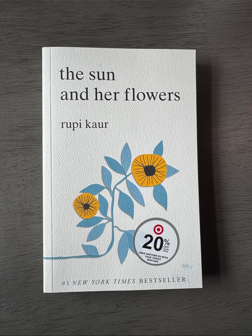 The Sun and Her Flowers Rupi Kaur — White Cover with Yellow & Blue Floral Design